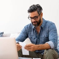 Person smiling because they made a receipt using our receipt generator.